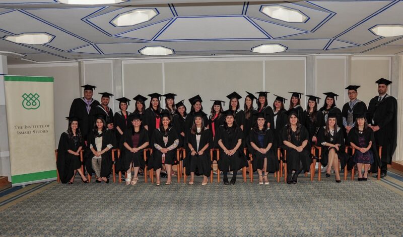 A bunch of graduates posing for a photo in their convocation gowns
