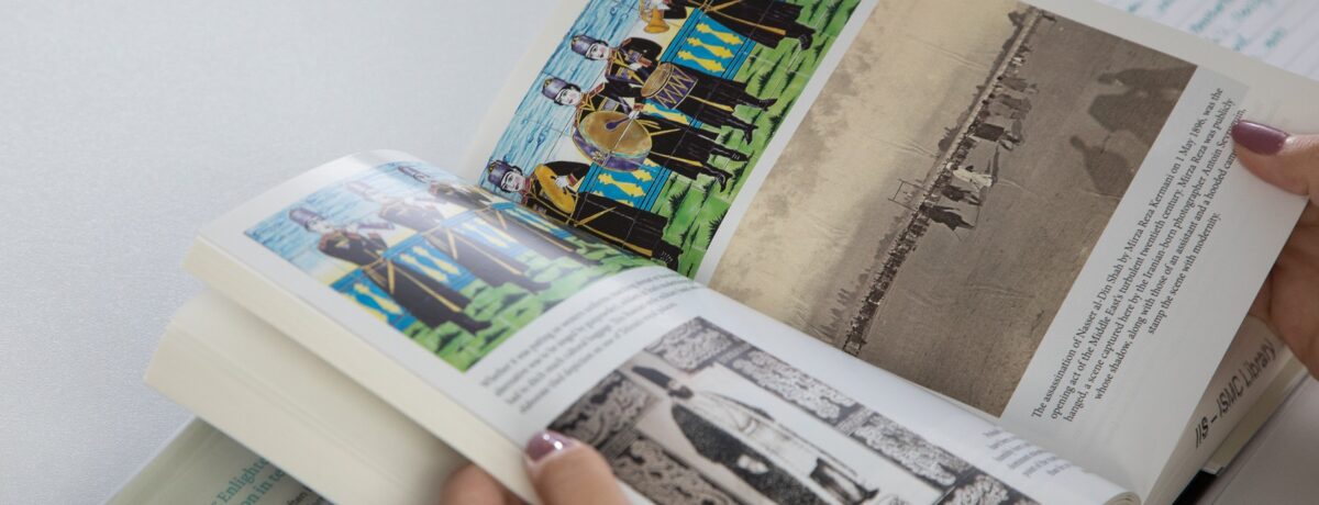 An open book with some graphics and text