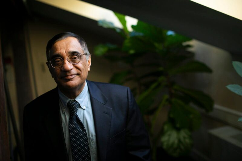 Landscape photo of Professor Ali Asani in a black suit