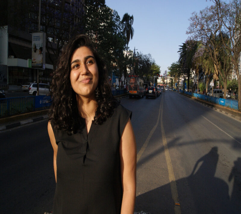 A picture of a GPISH student Nabila Walji in black dress from Nairobi streets