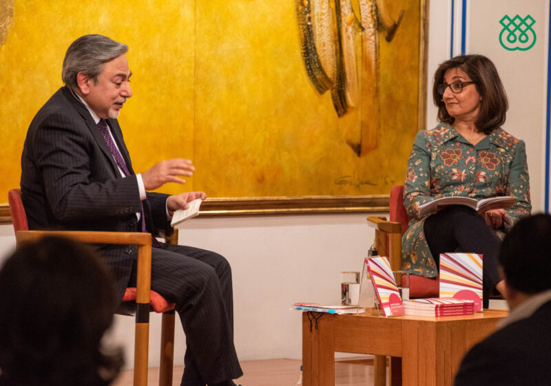 Dr Shiraz Kabani and a lady discussing Ismaili Festivals: Stories of Celebration, in a book launch event in Ismaili centre (social hall)