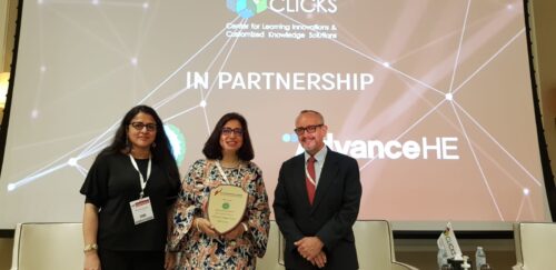 Tashmin, a Zairi Awardee in the centre with two dignitaries on two sides posing for a picture