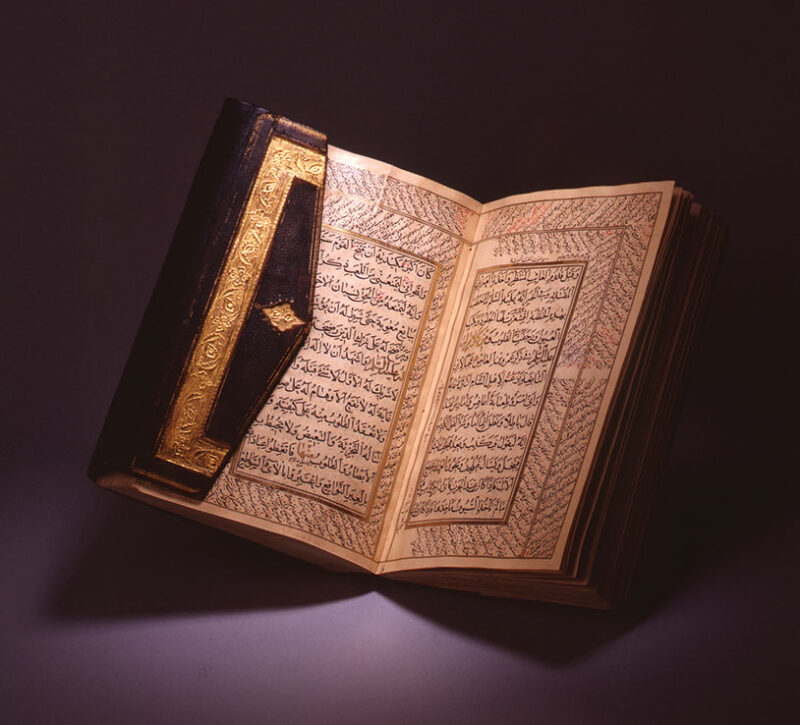 An open with two sided pages with Arabic written in them.