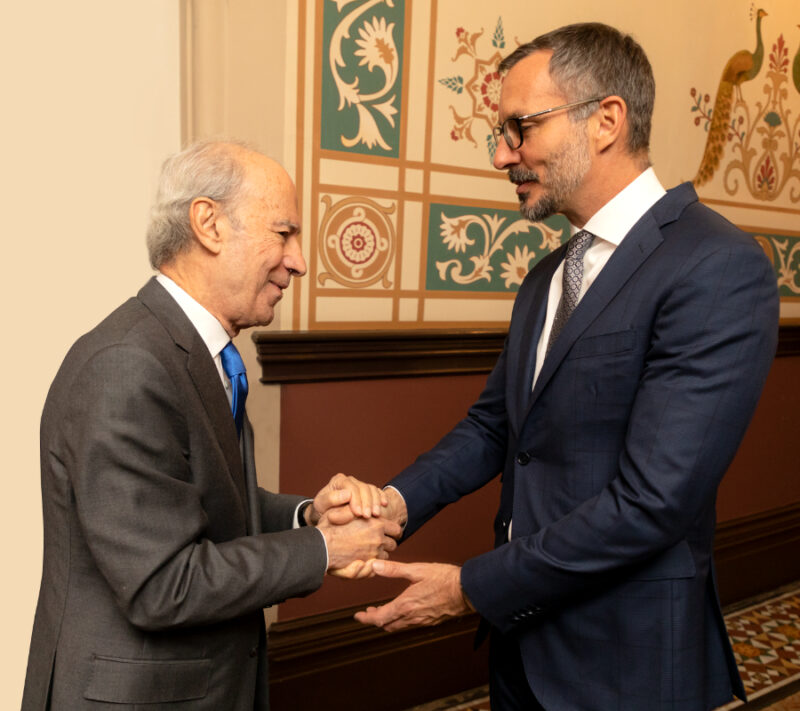 Prince Rahim and IIS Co Director Dr. Farhad Daftary exchanging gratitude gestures while shaking hands
