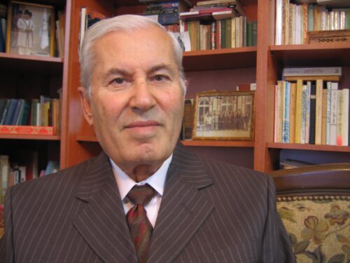 Aitmadi Mohamad Ismail Adra Abu Nu‘man (M.Adra) sitting in a suit