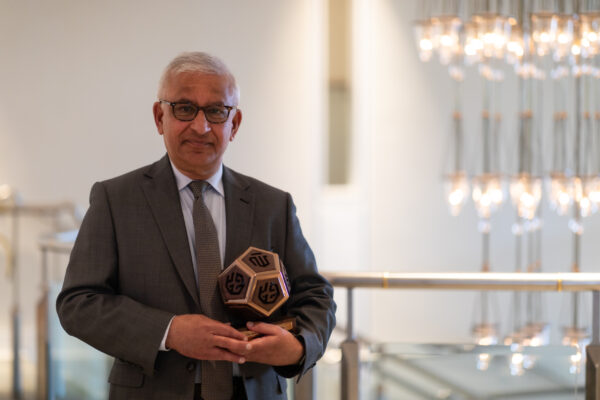 Prof Karim H Karim holding IIS Alumni Recognition Programme award