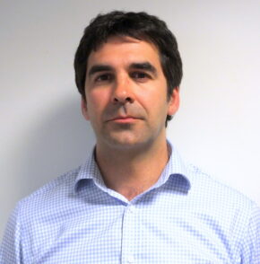 A passport size photo of Dr. Omar