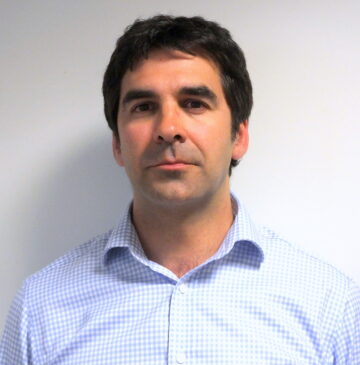 A passport size photo of Dr. Omar