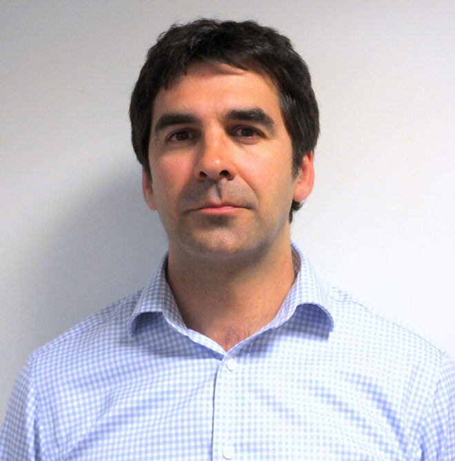 A passport size photo of Dr. Omar