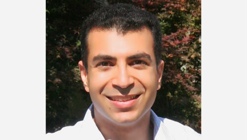 A head shot of a man in white shirt